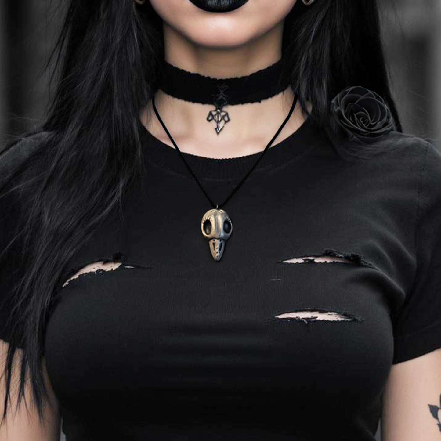 Handmade ceramic raven skull necklace on black cord