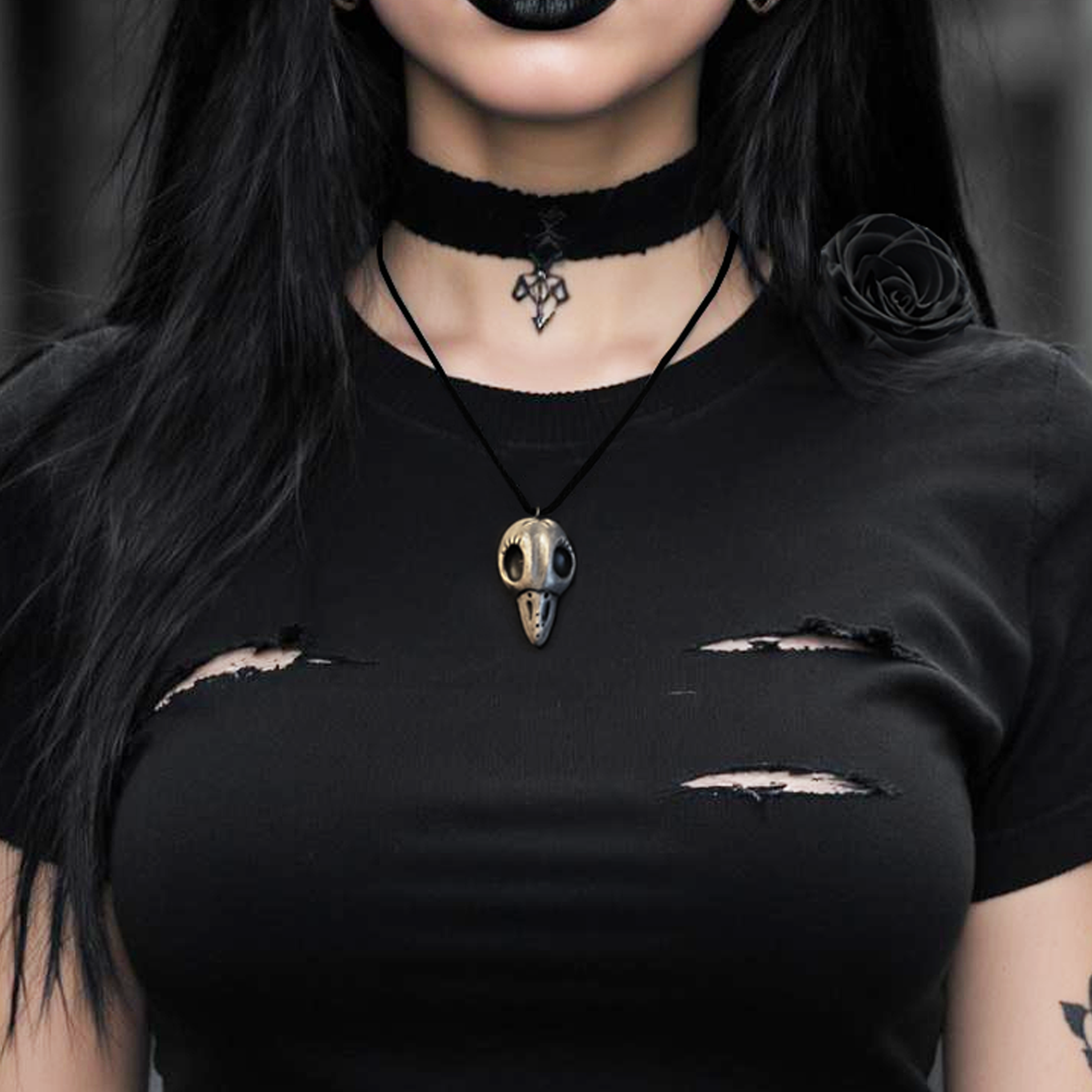 Handmade ceramic raven skull necklace on black cord